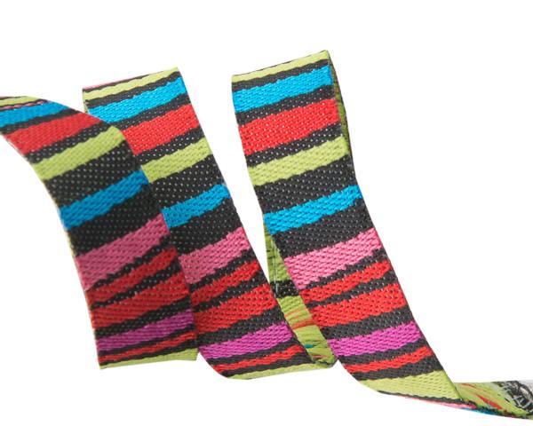 A spool of Dark Fanciful Stripes ribbon in a variety of bright and dark colors, used for crafting and sewing.
Photo by renaissanceribbon.com [image_link]