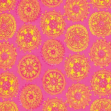 Bright pink fabric with a repeating pattern of orange and yellow circular floral medallions, with a small black-and-white size tag placed on the right side.
[additional_image_link]
