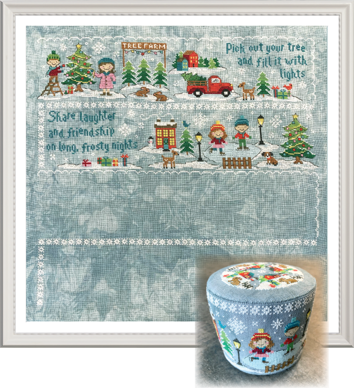A framed winter-themed needlework or embroidery design with a snowy village scene, children, trees, a red truck, and decorative text, shown alongside a matching small cylindrical container with the same illustrated lid.
Photo by Tiny Modernist [additional_image_link]