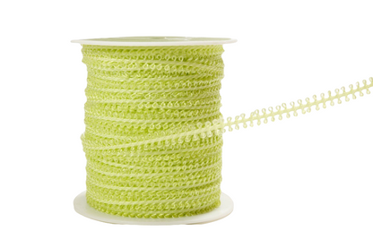 A spool of lime green decorative ribbon with a scalloped edge, shown on a clean white background.
[additional_image_link]