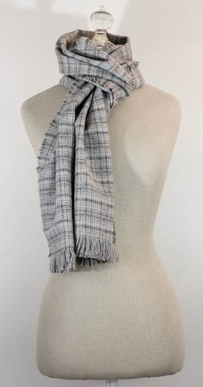 A gray tartan plaid flannel scarf with fringe, displayed on a mannequin.
Photo by Karen King  [additional_image_link]