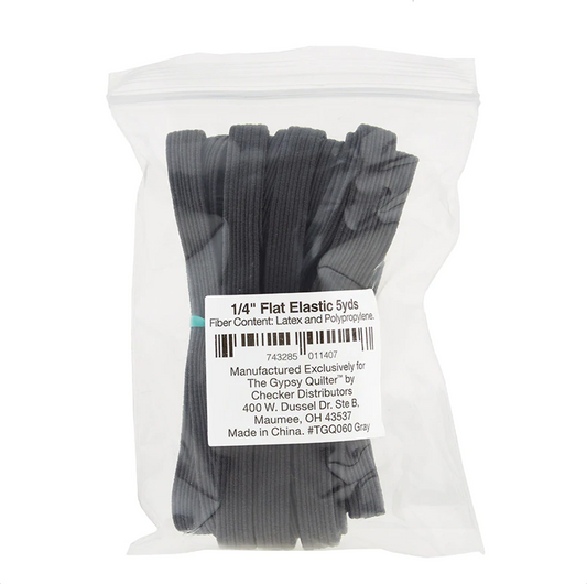 A pack of flat gray elastic bands, labeled as 1/4 inch elastic, 5 yards in length, made by Gypsy Quilter.