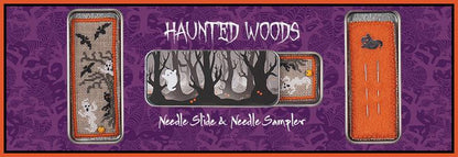 The image shows a cross stitch embroidery kit titled 'Haunted Woods', featuring a needle slide and a needle sampler. The design includes a nighttime scene with trees, a bat, and a ghost, as well as a spiderweb.
Photo by JustNan.com [additional_image_link]