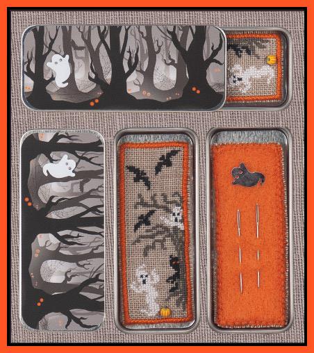 The image shows a cross stitch embroidery kit titled 'Haunted Woods', featuring a needle slide and a needle sampler. The design includes a nighttime scene with trees, a bat, and a ghost, as well as a spiderweb.
Photo by JustNan.com [additional_image_link]