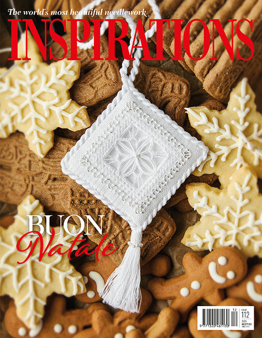 Cover of a needlework magazine titled 'INSPIRATIONS' with a white crocheted square ornament hanging over decorated gingerbread cookies. Large red text reads 'INSPIRATIONS' at the top, and 'BUON Natale' appears in white and red near the lower left.
Photo by InspirationsStudios.com [image_link]