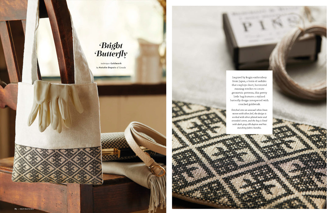A magazine-style spread showing a tote bag on a wooden chair, with a close-up of a patterned textile and small text blocks. The bag appears to be the featured product, with cream fabric, dark patterned lower section, and a small beige glove detail on the front.
Photo by InspirationsStudios.com [additional_image_link]