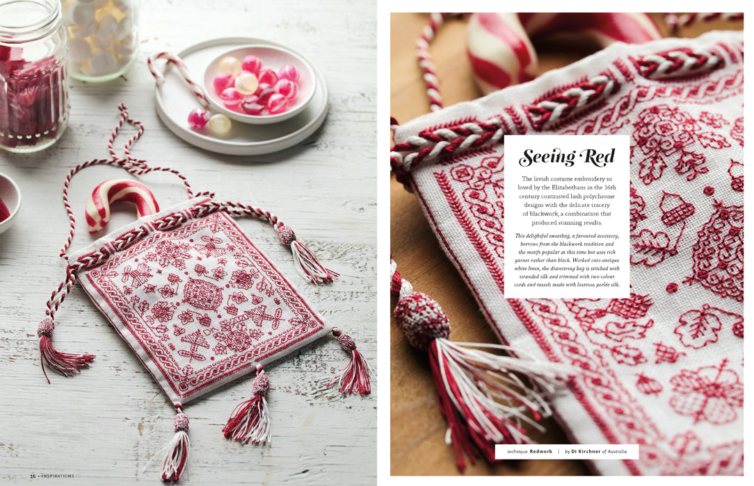 A styled product photo of a square embroidered hanging textile with braided tassel cords, shown in a split layout. The left side shows the hanging ornament on a white wood surface with candy canes and small bowls nearby.
Photo by InspirationsStudios.com [additional_image_link]