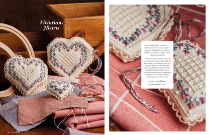 A book or magazine spread showing handmade heart-shaped embroidered or crocheted ornaments with lace trim, arranged on fabric and wooden props. The left panel includes the text 'Victorian Hearts,' and the right panel shows a close-up of one ornament with a small text box describing the project.
Photo by InspirationsStudios.com [additional_image_link]