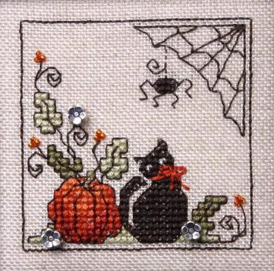 A cross stitch kit image featuring a black kitty and a pumpkin with a spider web in the background, and small decorative beads used in the embroidery.
Photo by The Sweetheart Tree [image_link]