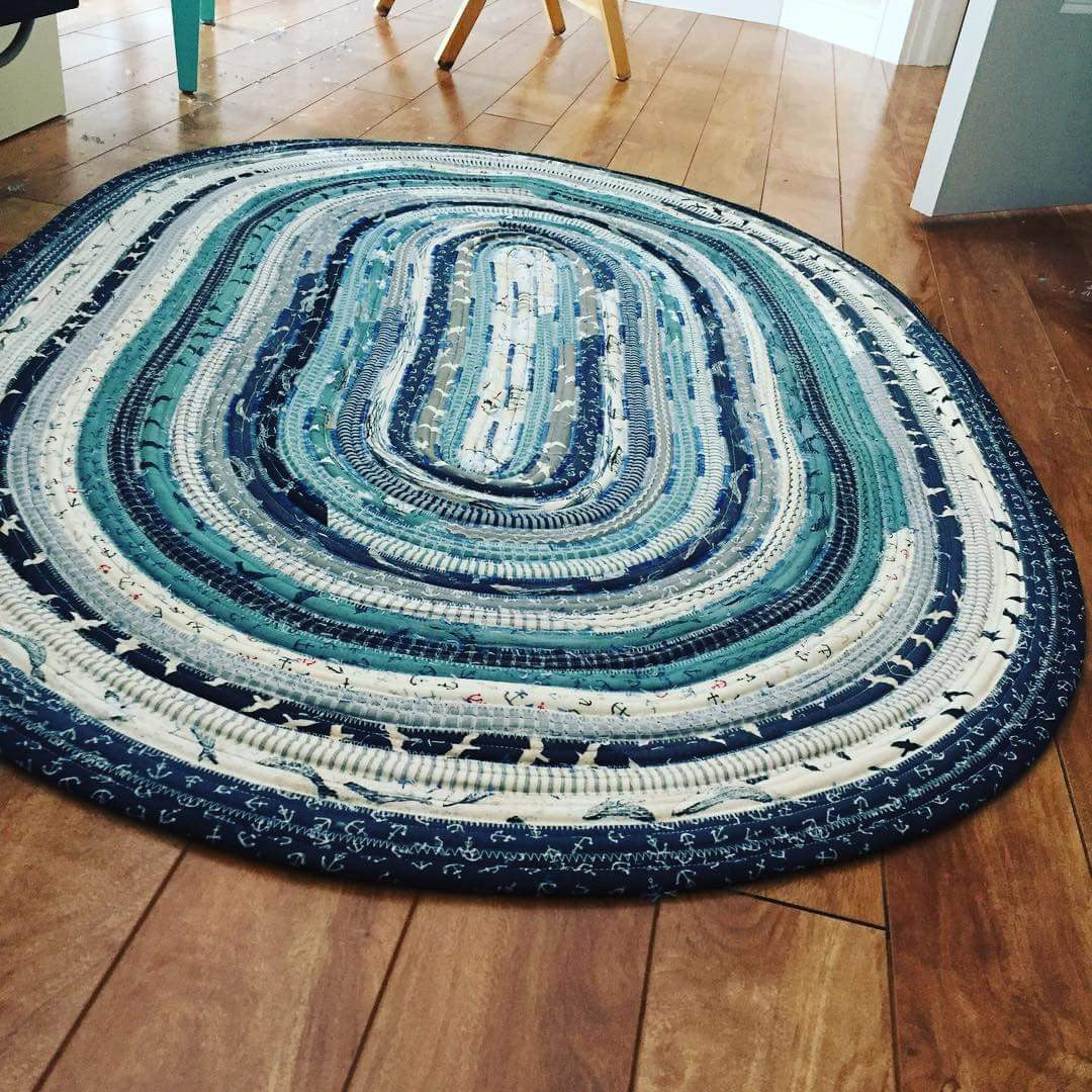 Multicolor jelly roll rug. Mostly blue, white and green.
Photo by R.J .Designs [additional_image_link]