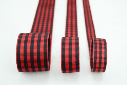 Three rolls of red and black buffalo plaid ribbon on a white background.
Photo by RibbonBazaar.com [additional_image_link]