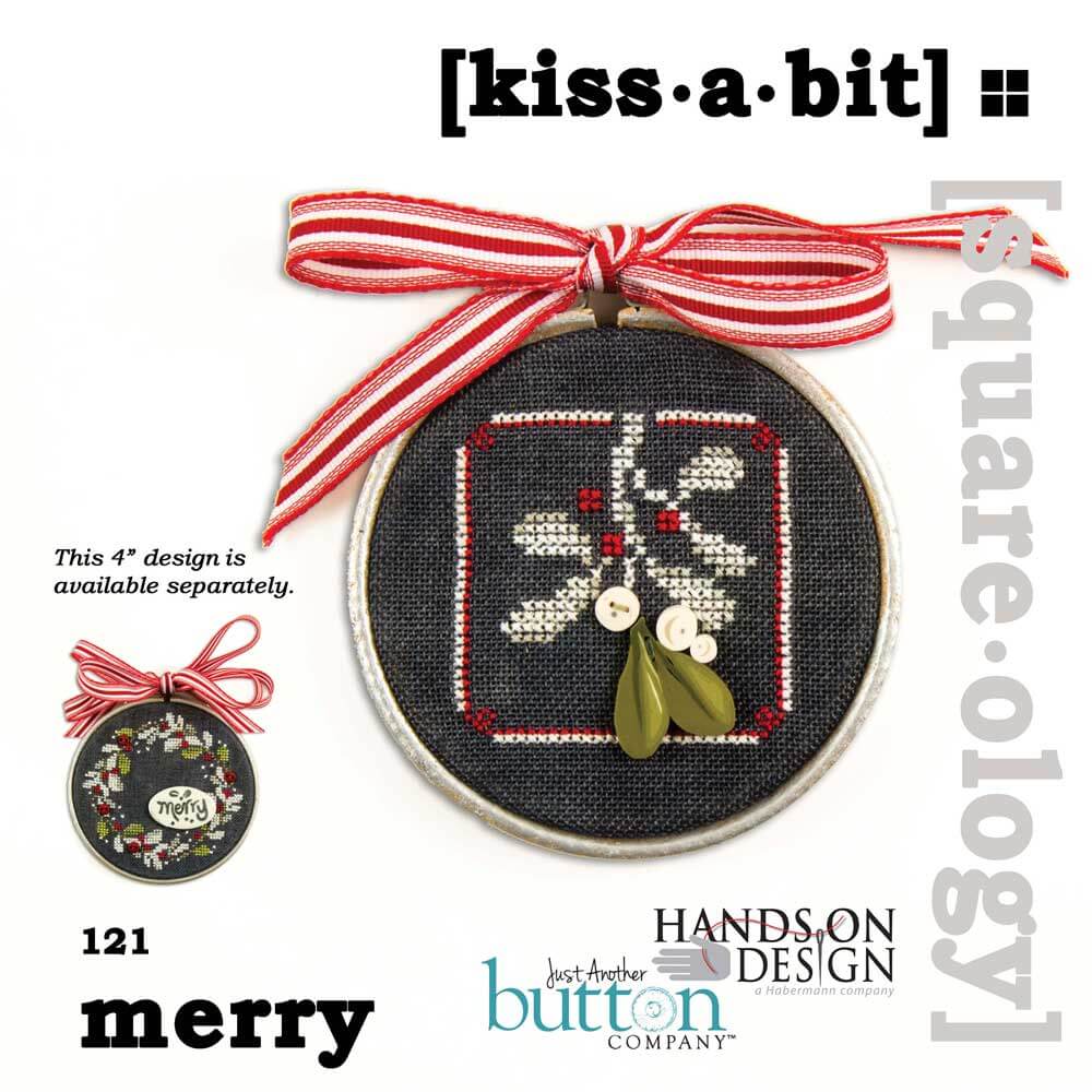 A circular embroidery hoop featuring a black fabric background with a stitched white, red, and green holiday design, tied with a red-and-white striped ribbon. The image includes text reading '[kiss·a·bit]' and 'merry', plus branding for Hands On Design and Jess' Another Button Company.
Photo by JustAnotherButtonCompany.com [image_link]