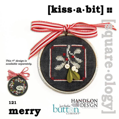 A circular embroidery hoop featuring a black fabric background with a stitched white, red, and green holiday design, tied with a red-and-white striped ribbon. The image includes text reading '[kiss·a·bit]' and 'merry', plus branding for Hands On Design and Jess' Another Button Company.
Photo by JustAnotherButtonCompany.com [image_link]