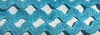 A close-up of a wavy, textured ric rac in a bright turquoise blue color, filling the entire frame.
Photo by Handsondesign.com [additional_image_link]
