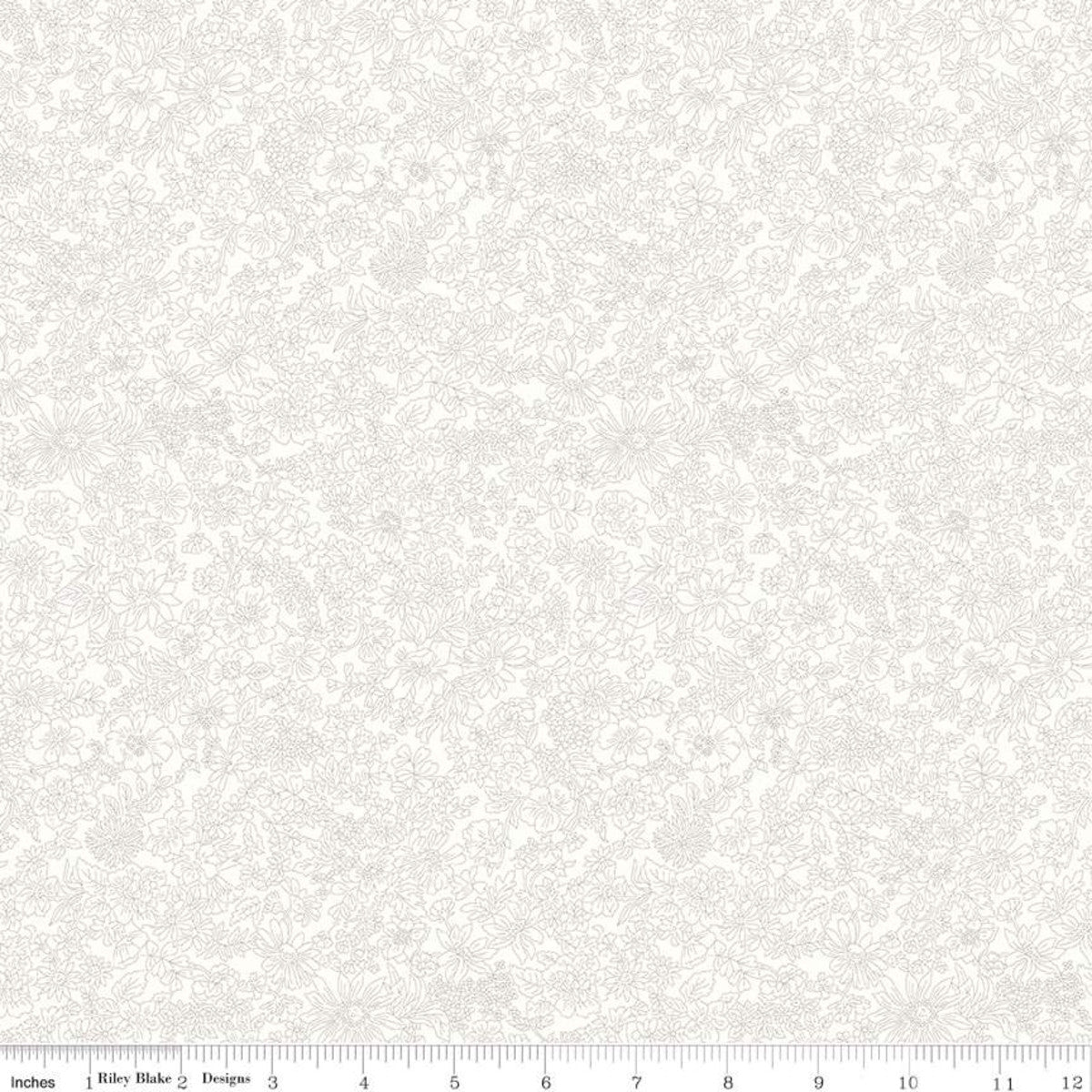 A close-up of a light cream fabric with a subtle, tonal damask or floral scroll pattern, featuring a white ruler scale at the bottom indicating 12 inches.
Photo by RileyBlakeDesigns.com [image_link]