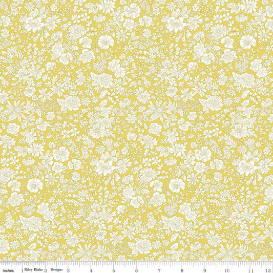 Yellow fabric with a dense white floral toile pattern, shown flat with a ruler along the bottom edge for scale.
Photo by RileyBlakeDesigns.com [image_link]