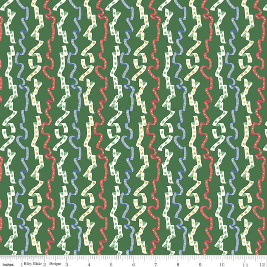 A close-up of a fabric pattern featuring vertical wavy stripes in cream, light blue, and red on a dark green background, with a ruler along the bottom edge showing scale.
Photo by RileyBlakeDesigns.com [image_link]