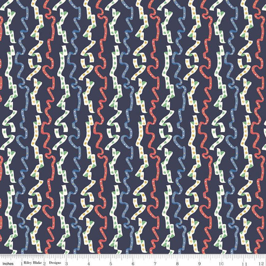 A textured image of Christmas-themed fabric from the Merry and Bright Collection, featuring a repeating pattern with various colors like blue, red, and green.
Photo by RileyBlakeDesigns.com [image_link]