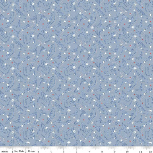 A fabric from the Merry and Bright Collection by Liberty Fabrics featuring a blue background with white and red dove star patterns.
Photo by RileyBlakeDesigns.com [image_link]