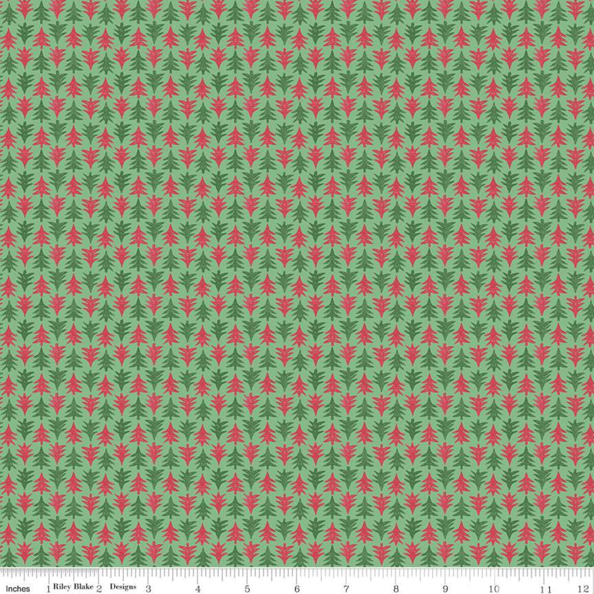 A repeating fabric pattern featuring small red pine trees on a sage green background, with a white ruler along the bottom edge showing measurements in inches. The text 'Riley Blake Designs' is visible on the ruler.
Photo by RileyBlakeDesigns.com [image_link]