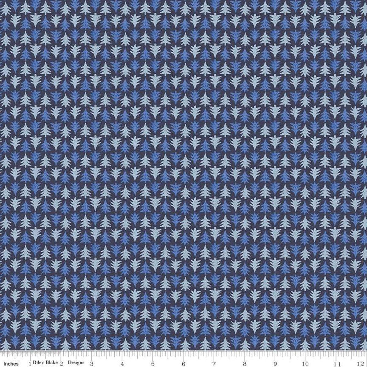 A close-up of a repeating fabric or wallpaper pattern showing small stylized leaf or pine-like motifs in light blue, medium blue, and white on a dark navy background, with a ruler strip along the bottom edge.
Photo by RileyBlakeDesigns.com [image_link]