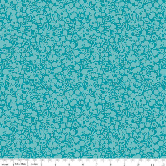 A close-up of a repeating floral pattern in turquoise and light aqua, with a ruler strip along the bottom edge showing scale. The design appears to be fabric or wallpaper pattern information rather than a standalone product photo.
Photo by RileyBlakeDesigns.com [image_link]