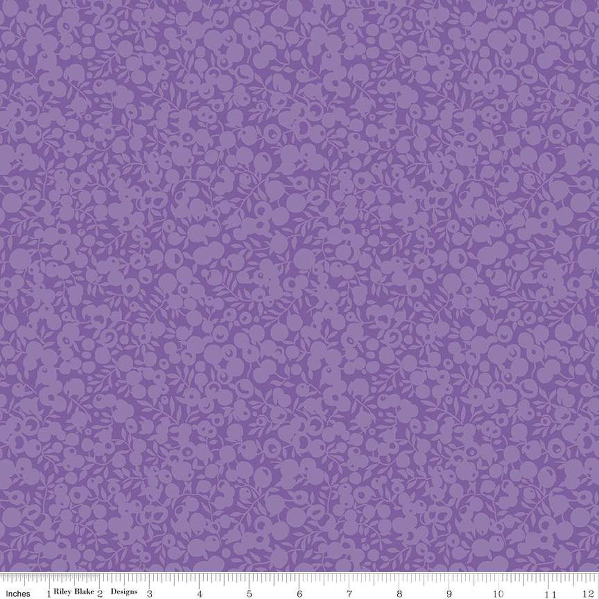 Purple fabric with a dense small floral and leaf pattern, shown flat with a ruler along the bottom edge for scale.
Photo by RileyBlakeDesigns.com [image_link]