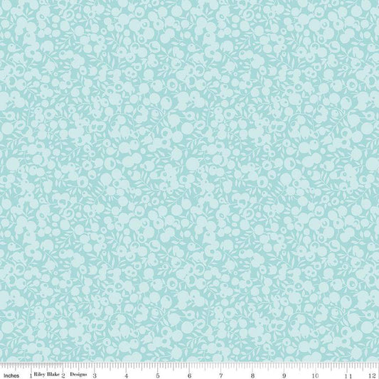 A close-up of a fabric from the Liberty Fabrics Wiltshire Shadow Sea Glass collection, showing a detailed view of the leaf and berry print in a sea foam green color.
Photo by RileyBlakeDesigns.com [image_link]