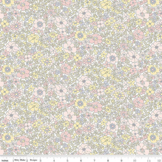 A close-up of a repeating floral fabric pattern with small pink, yellow, and lavender flowers outlined in gray on a white background, with a ruler along the bottom edge showing scale.
Photo by RileyBlakeDesigns.com [image_link]