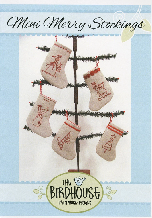 Pattern cover for 'Mini Merry Stockings' by The Birdhouse Patchwork & Designs, showing five beige embroidered Christmas stockings hanging on a small tree against a light blue and white background.
Photo by The Birdhouse Patchwork Designs [image_link]