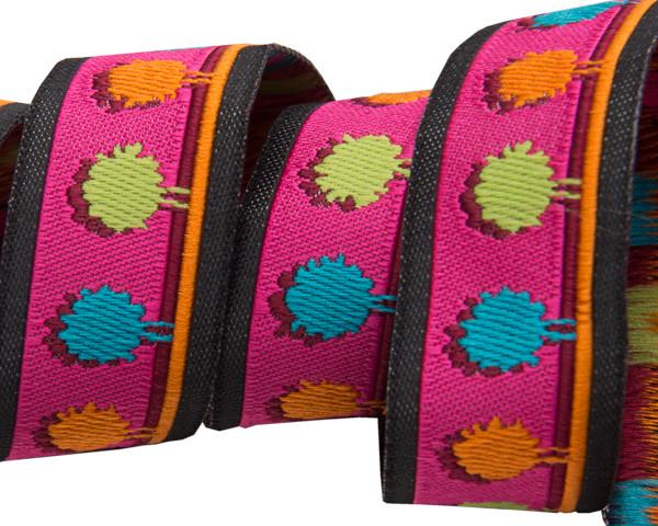 A spool of multi-colored pompoms on a hot pink jacquard ribbon, used for crafting and sewing.
Photo by RenaissanceRibbons.com [image_link]