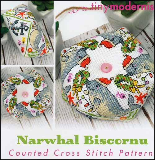A cross stitch embroidery kit depicting a multicolored design with Christmas-themed elements and narwhal biscornu, with the text 'Narwhal Biscornu' and 'Counted Cross Stitch Pattern'.
Photo by Tiny Modernist [image_link]