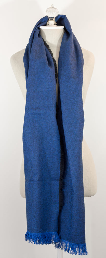 Navy blue herringbone flannel blanket scarf displayed on a mannequin, with fringe detailing and a kilt pin.
Photo by Karen King  [additional_image_link]