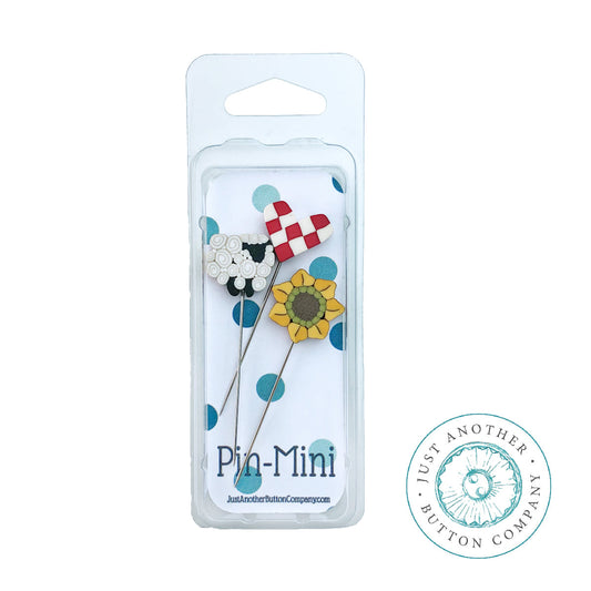 JABC pin mini with a sheep, a red and white checker heart and a sunflower.
Photo by JustAnotherButtonCompany.com [image_link]