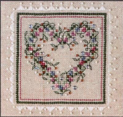 A cross stitch embroidery kit packaging from The Sweetheart Tree featuring a heart-shaped design with floral patterns.
Photo by The Sweetheart Tree [image_link]