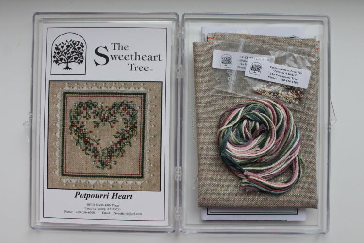 A cross stitch embroidery kit packaging from The Sweetheart Tree featuring a heart-shaped design with floral patterns.
Photo by The Sweetheart Tree [additional_image_link]