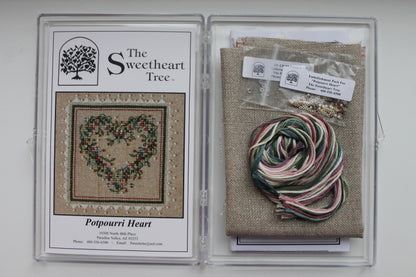 A cross stitch embroidery kit packaging from The Sweetheart Tree featuring a heart-shaped design with floral patterns.
Photo by The Sweetheart Tree [additional_image_link]