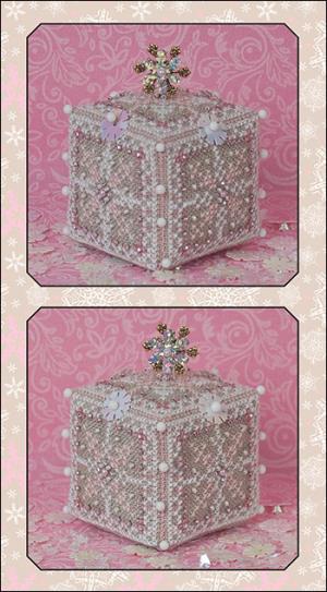 A cross stitch embroidery kit depicting a pink ice cube ornament, with a close-up of the textured linen and embellishments.
Photo by JustNan.com [image_link]