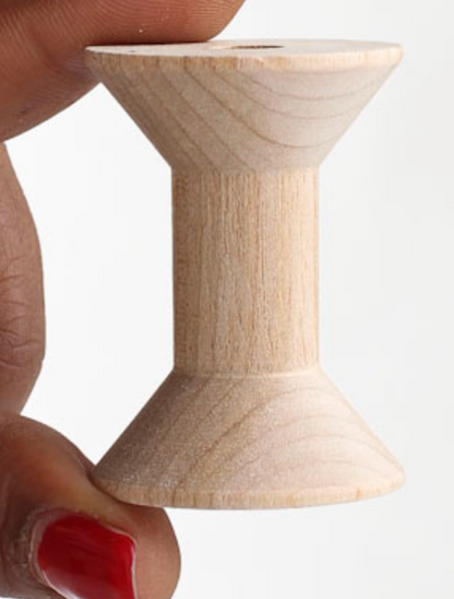 Wooden spool.
[additional_image_link]