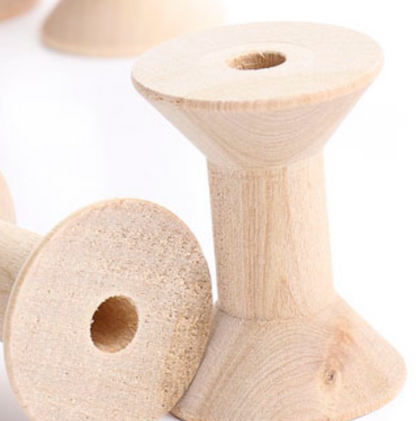 Wooden spools.
[additional_image_link]