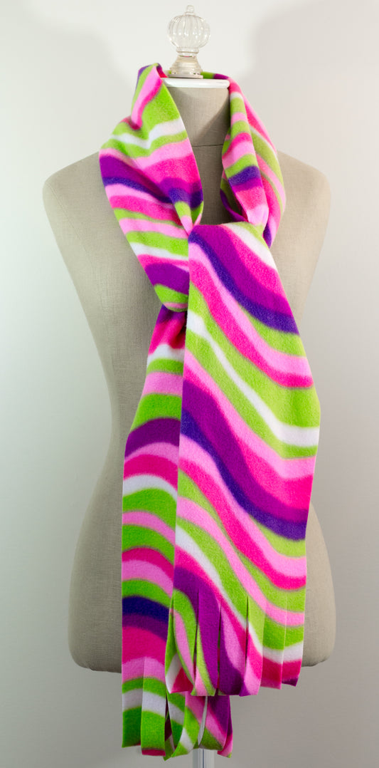A scarf with a striped pattern featuring pink, green, white, and purple colors, displayed on a mannequin.
Photo by The Surgeon's Knots [image_link]