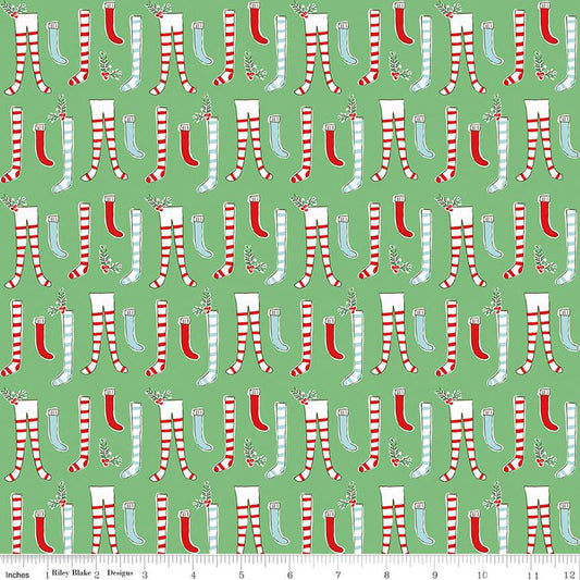 Green fabric with a Christmas-themed pattern featuring pairs of stockings and festive elements.
Photo by RileyBlakeDesigns.com [image_link]