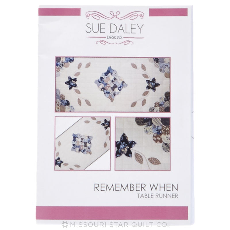 Packaging for a quilting pattern called 'Remember When' by Sue Daley, featuring images of the quilted fabric and a small inset picture showing the quilted design in detail.
Photo by Sue Daley [image_link]