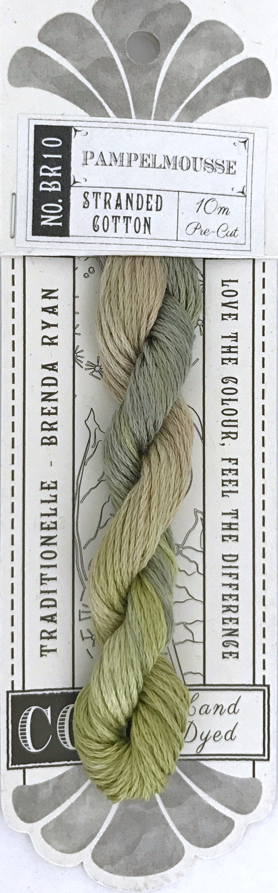 A packaged skein of Coe Fabrics 'Pampelmousse' stranded cotton embroidery floss. The floss is a variegated blend of sage green, olive green, and light beige.
Photo by cottagegardenthread.com [additional_image_link]