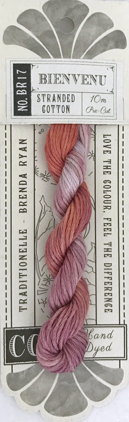 A skein of Coquette 'Bienvenu' stranded cotton embroidery floss in a dusty rose and mauve gradient, presented on its original white and gray cardboard packaging.
Photo by cottagegardenthread.com [additional_image_link]