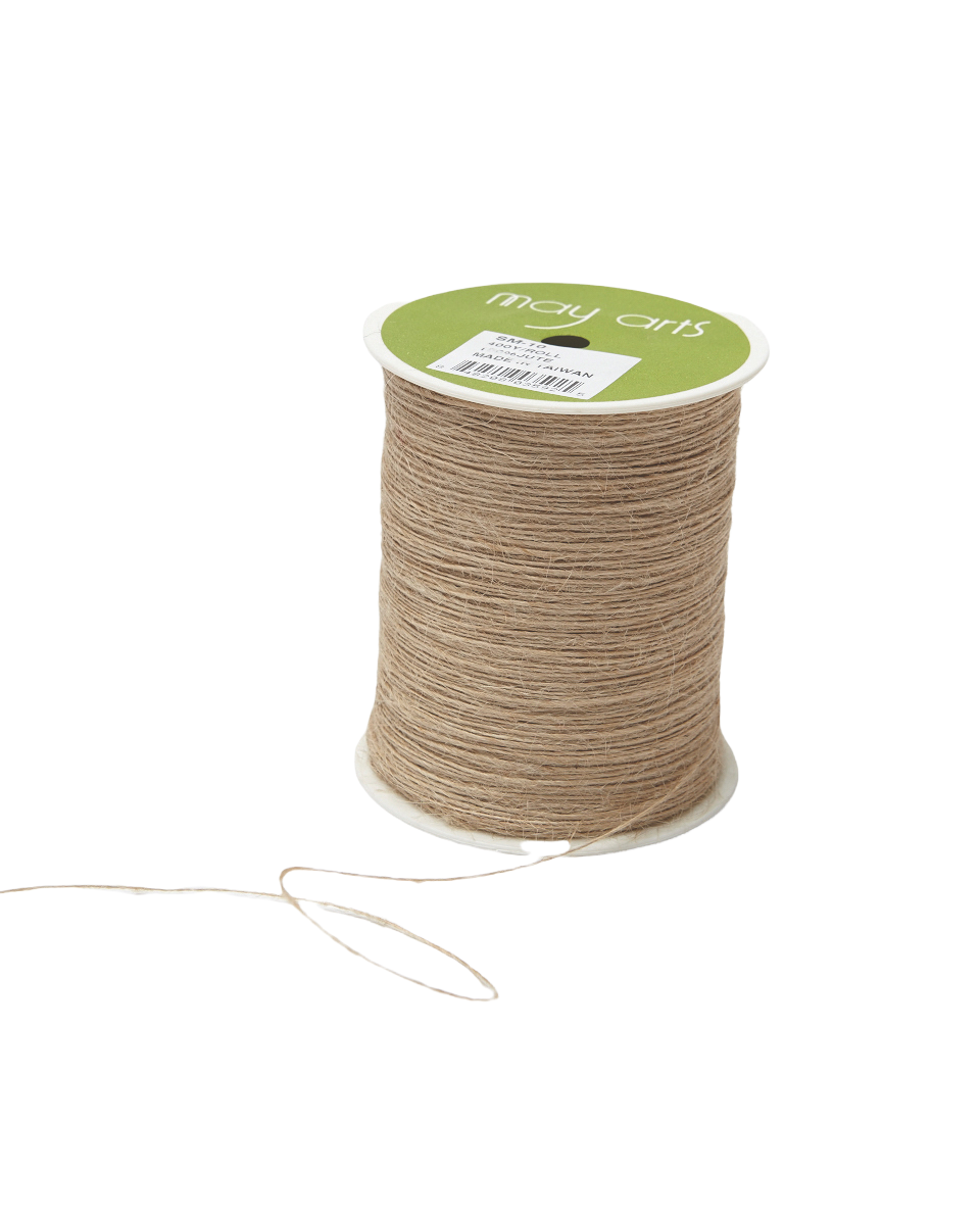 A spool of May Arts craft twine in a natural tan color, with a green and white label on a clean white background.
Photo by May Arts [additional_image_link]