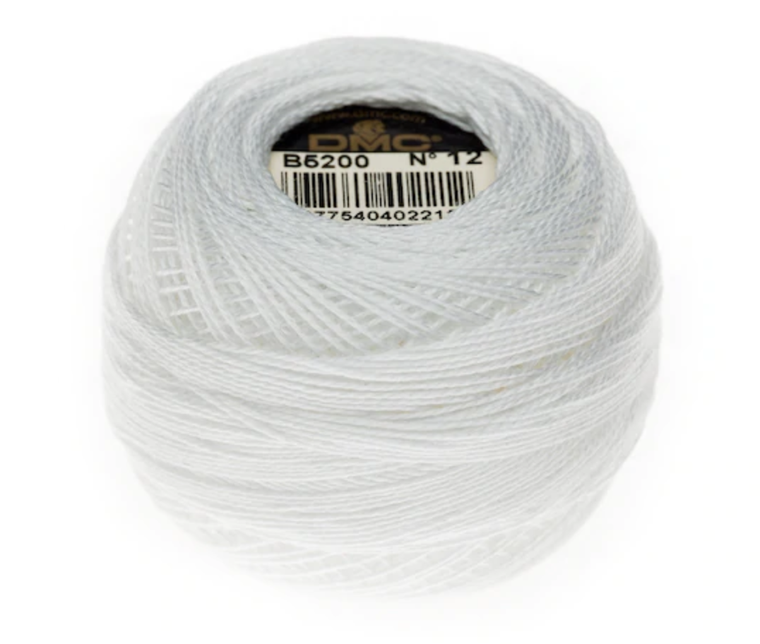 A ball of white embroidery thread with a paper label in the center, photographed on a clean white background.
Photo by Wichelt [additional_image_link]