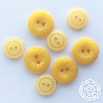 Yellow buttons from JABC.
Photo by JustAnotherButtonCompany.com [additional_image_link]