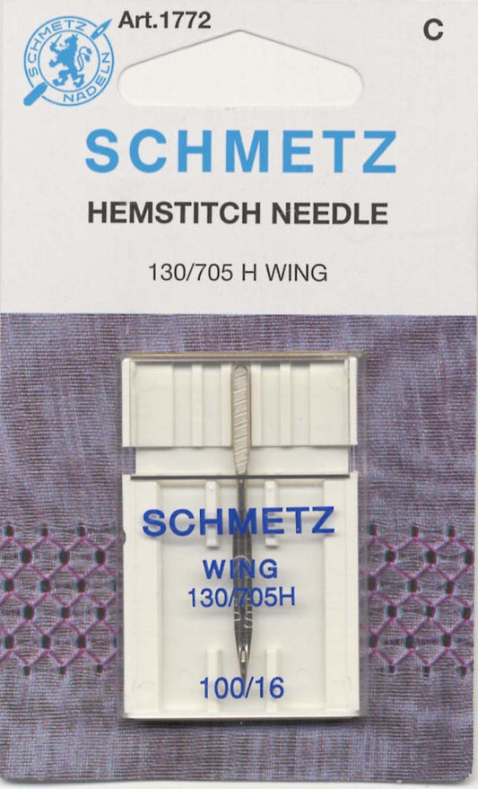 Schmetz 130/705 H Wing hemstitch needle in its original white and blue cardboard packaging, featuring a purple patterned background.
Photo by Schmetz [image_link]