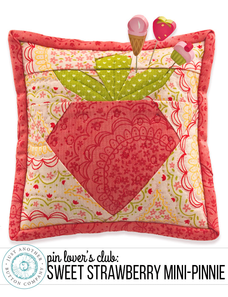 A handmade paper pieced pincushion pin cushion with a strawberry design, part of a limited edition 'Sweet Strawberry' pattern by Just Another Button Company.
Photo by JustAnotherButtonCompany.com [image_link]